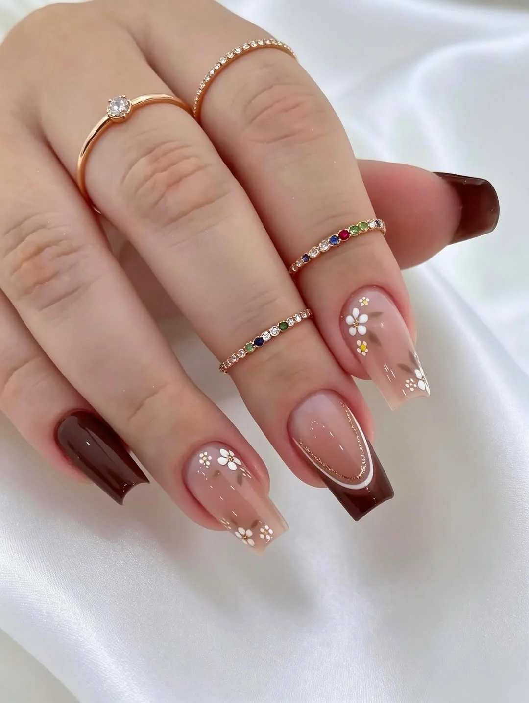 25 light summer nails 2026 Chocolate Glazed Florals With a Soft Nude Base
