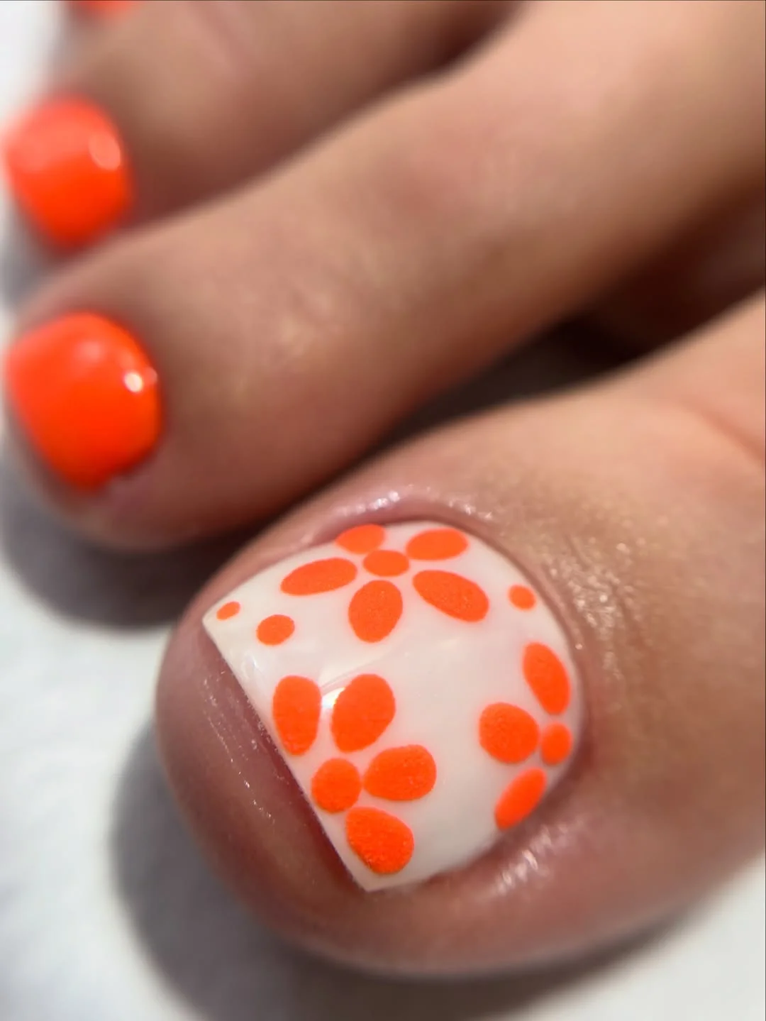23 pedicure ideas summer trends 2026 Retro Orange Flower Pedicure That Feels Straight Out of a Beach Movie