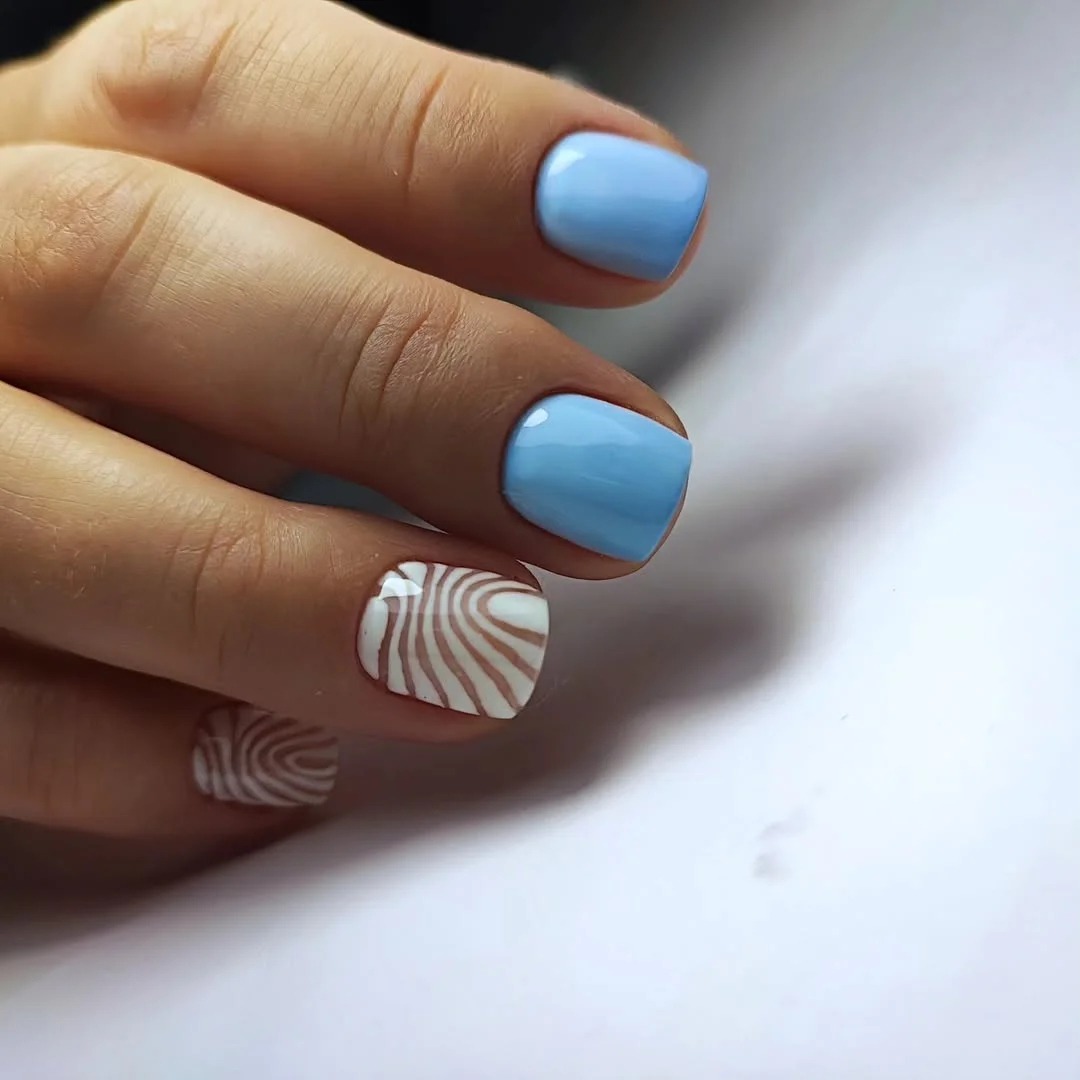 23 short squoval nails design 2026 Classy Blue Swirls With Modern Optical Art Details