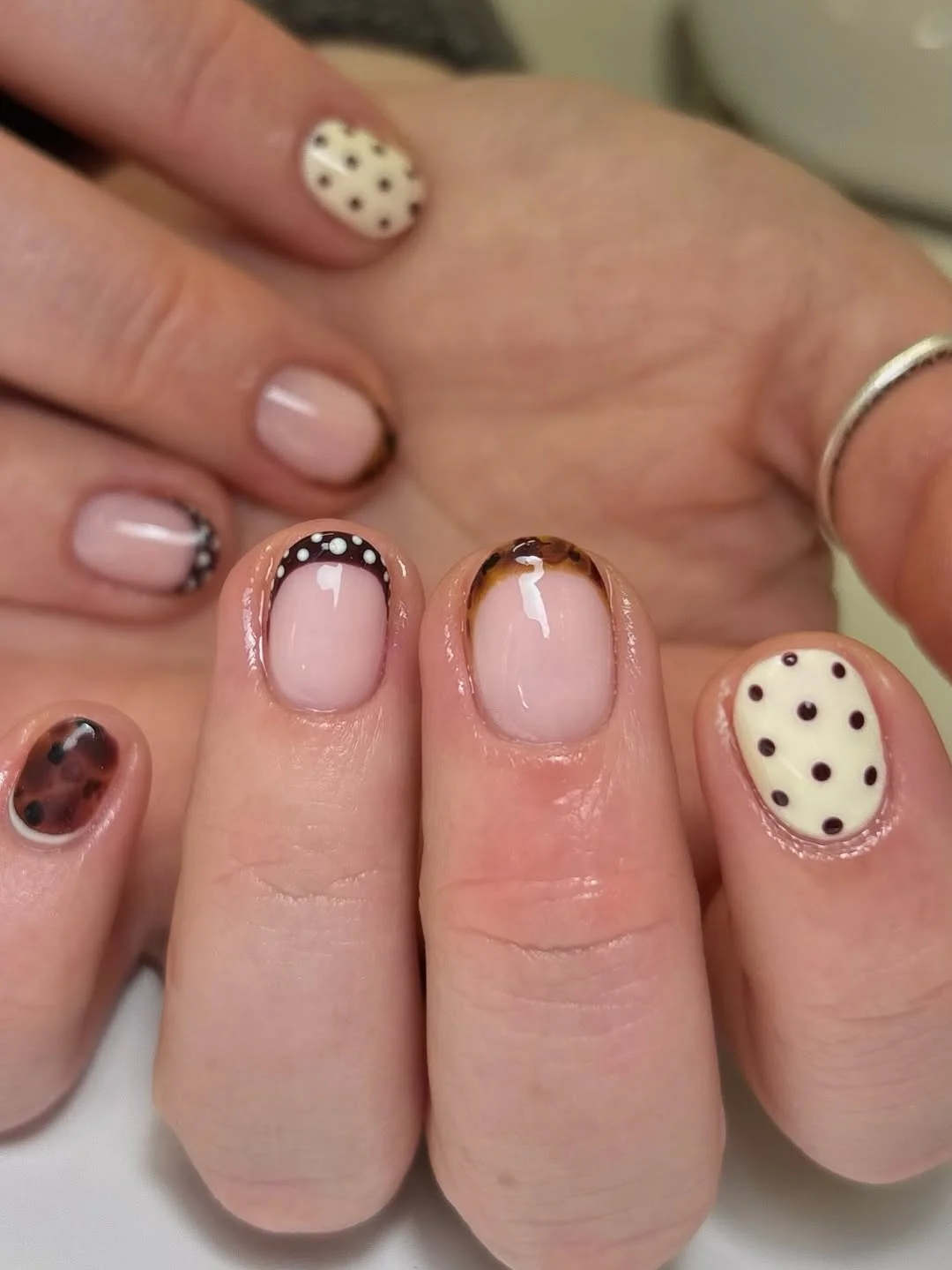 23 short squoval nails design 2026 Soft Tortoiseshell Details With Elegant Polka Dot Accents