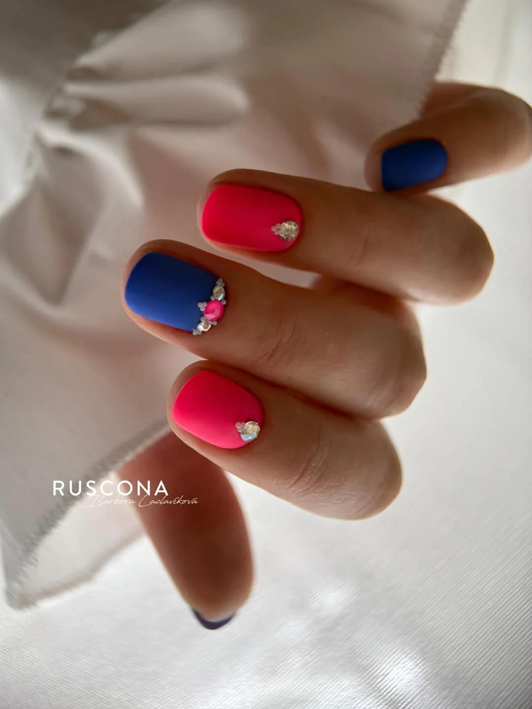 21 short summer nails 2026 Electric Pink And Blue Short Summer Nails With Crystal Details