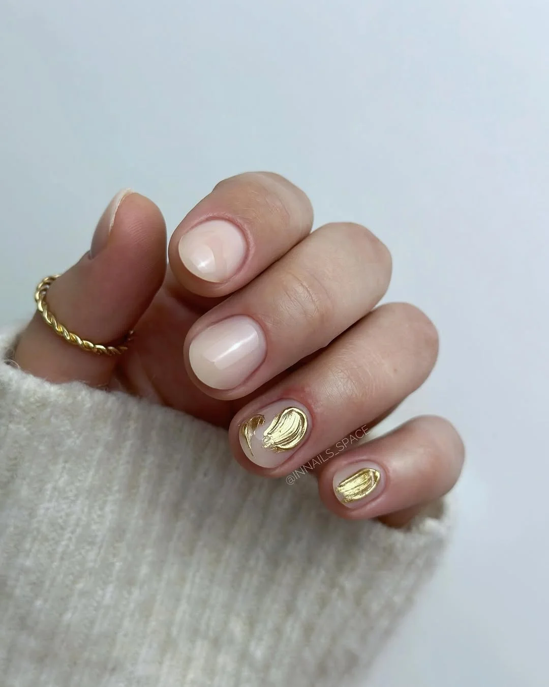21 short summer nails 2026 Minimal Nude Nails With Sculpted Gold Chrome Accents