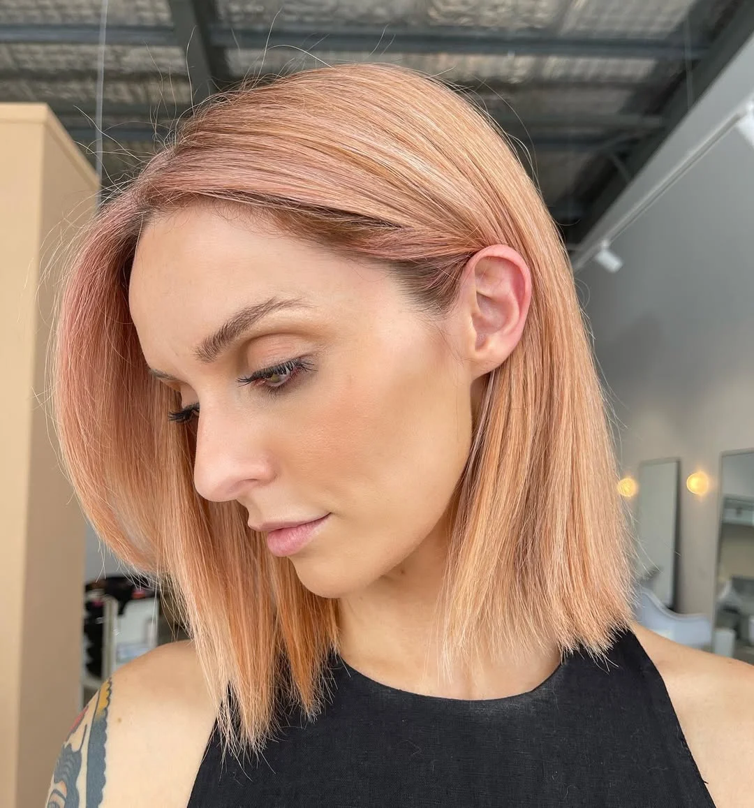 soft summer apricot blonde hair color 2026 Soft Peach Apricot Bob with Modern Edge