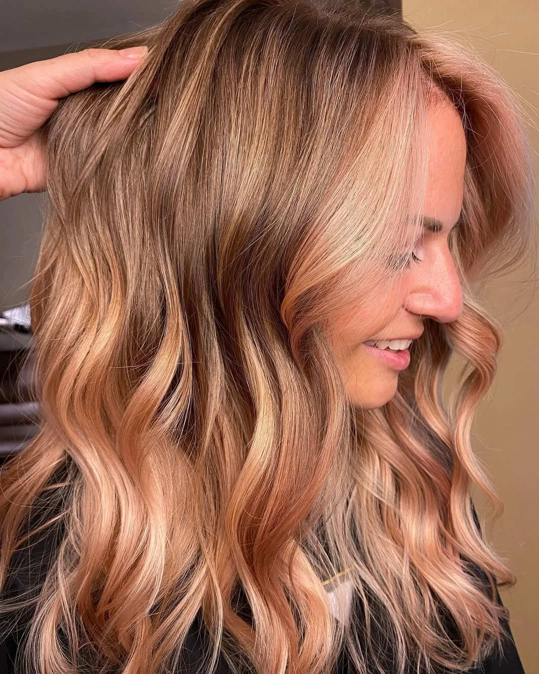soft summer apricot blonde hair color 2026 Dimensional Apricot Balayage with Lived-In Waves