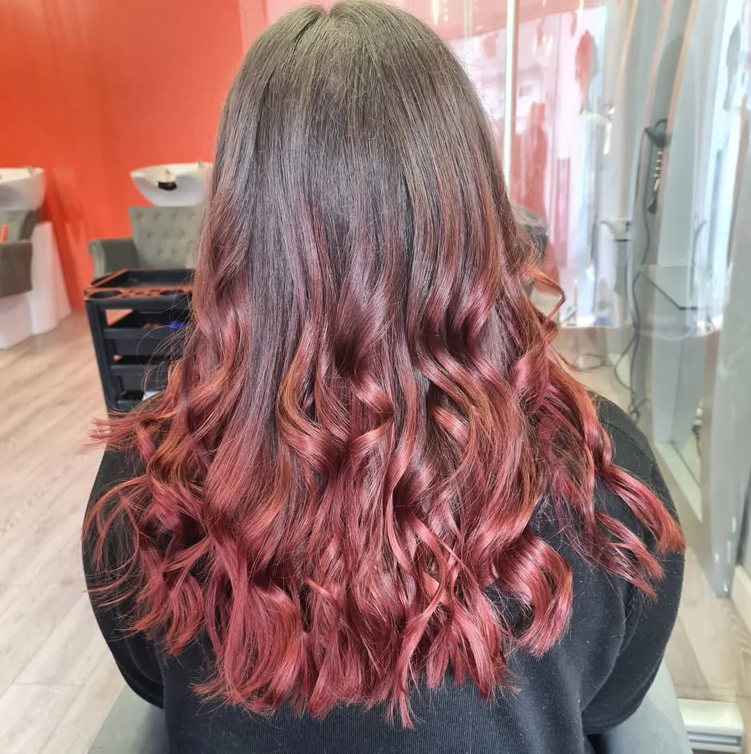 soft summer rose brunette hair color 2026 Deep Rose Ombre Brunette With Soft Curl Definition