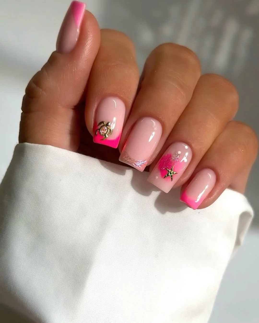 summer beach nails 2026 Pink Ombre Beach Nails With Tiny Ocean Charms