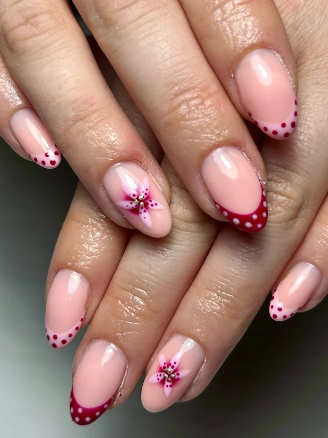 Summer French nails ideas 2026 Cherry Pink French Tips With Delicate Floral Details
