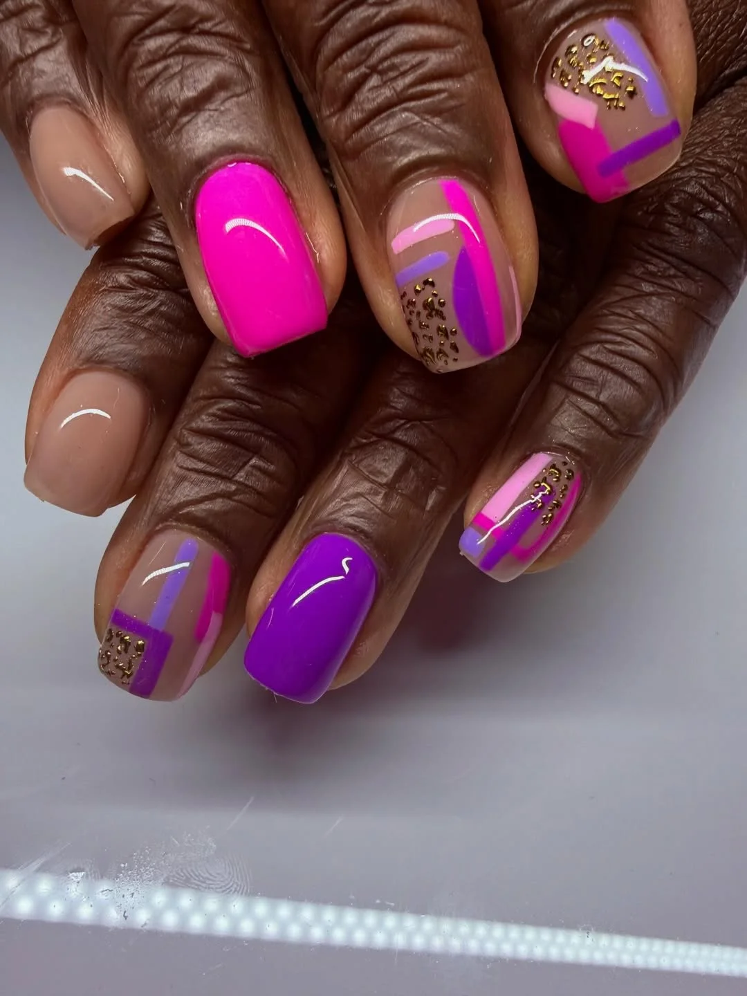 21 summer manicure color ideas 2026 Electric Pink And Purple Color Block Nails With Gold Accents