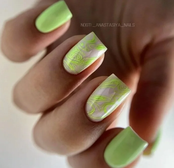 21 summer manicure color ideas 2026 Soft Matcha Green Swirls With Airy Marble Details