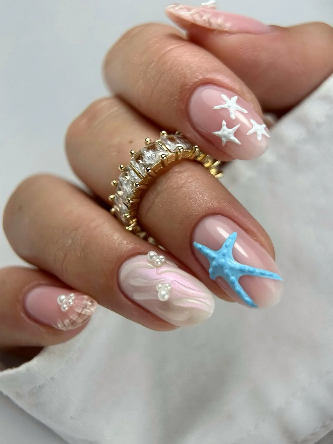summer nail art 2026 Soft Pearl Beach Nails With Delicate 3D Starfish Details