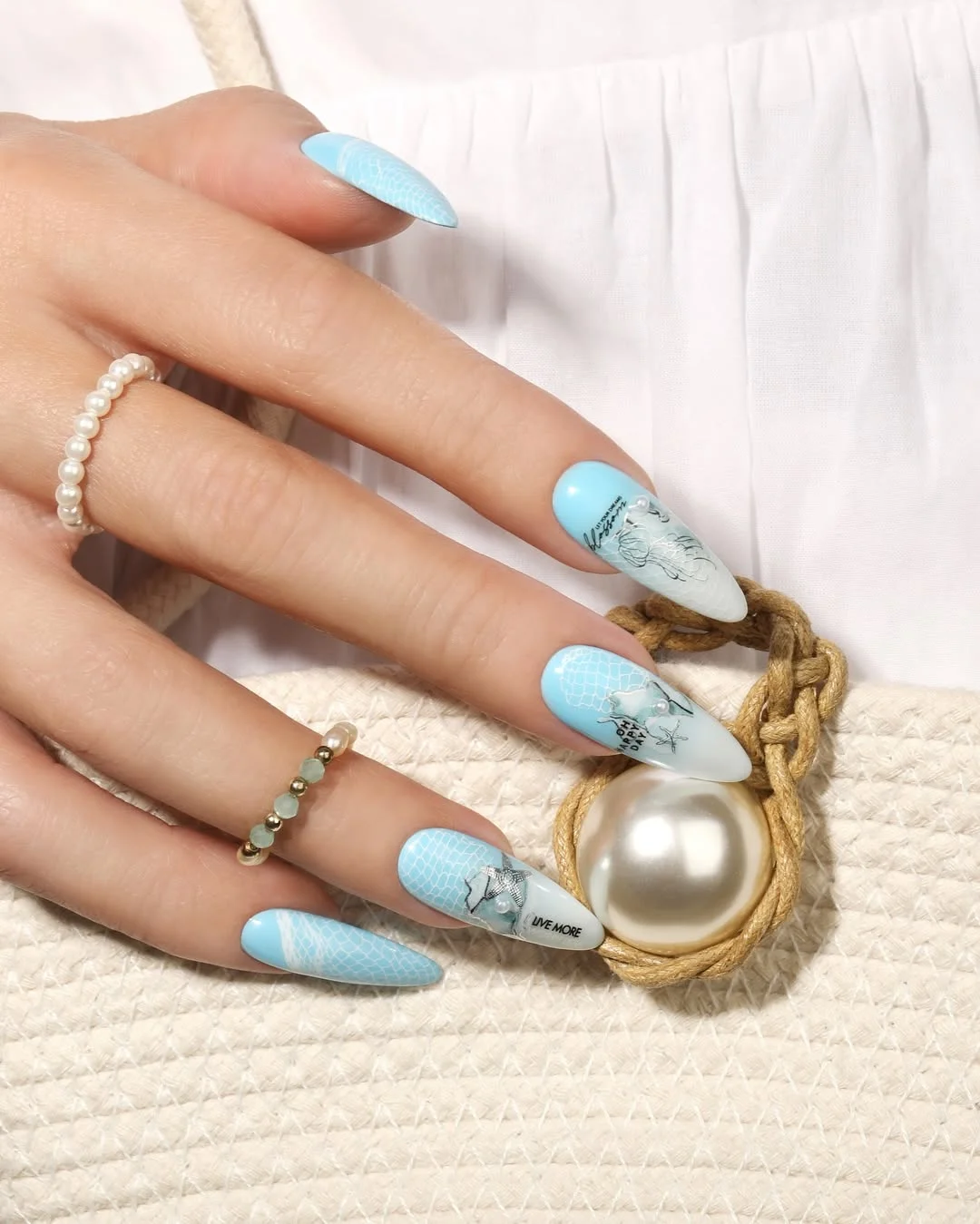 summer nail art 2026 Ocean Blue Almond Nails With Underwater Mermaid Details