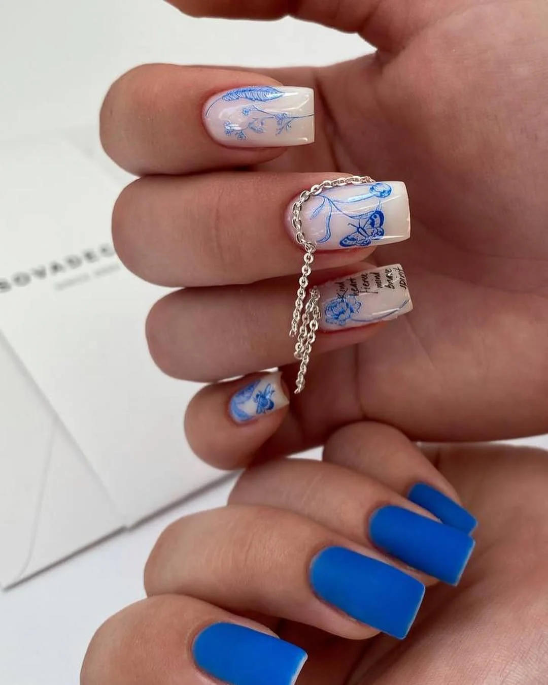 summer nail art 2026 Porcelain Blue Floral Nails With Soft Vintage Energy