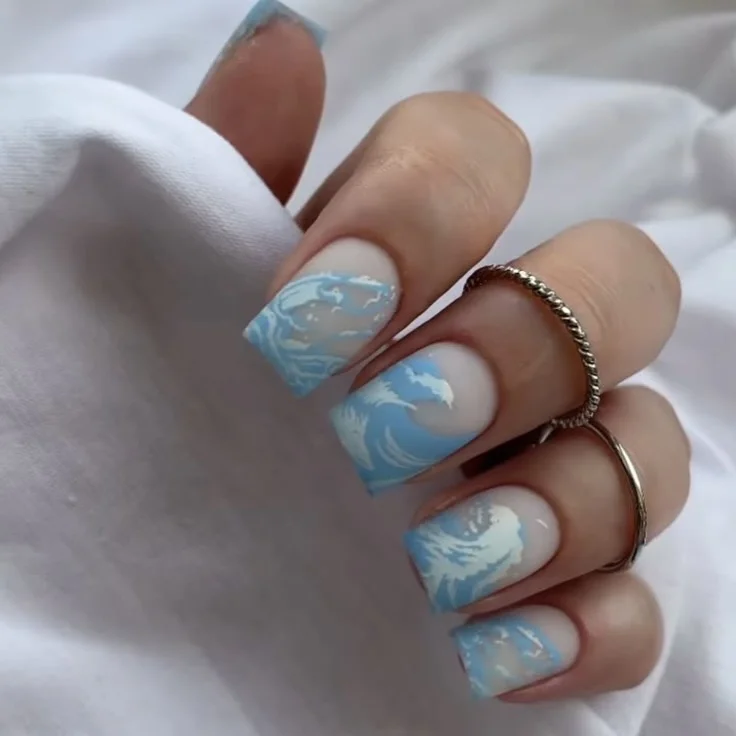 23 Summer nail art ideas 2026 Soft Ocean Wave Nails With Dreamy Blue Movement