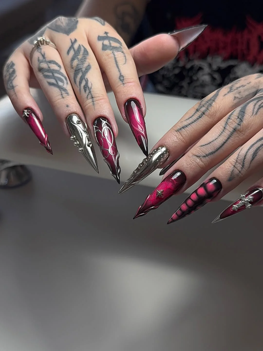 23 Summer nail art ideas 2026 Dark Chrome Stiletto Nails With Futuristic Edge