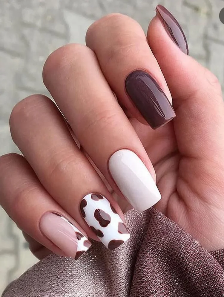 24 summer nail colors 2026 Chocolate Glaze and Cow Print Nails That Somehow Feel Quietly Expensive