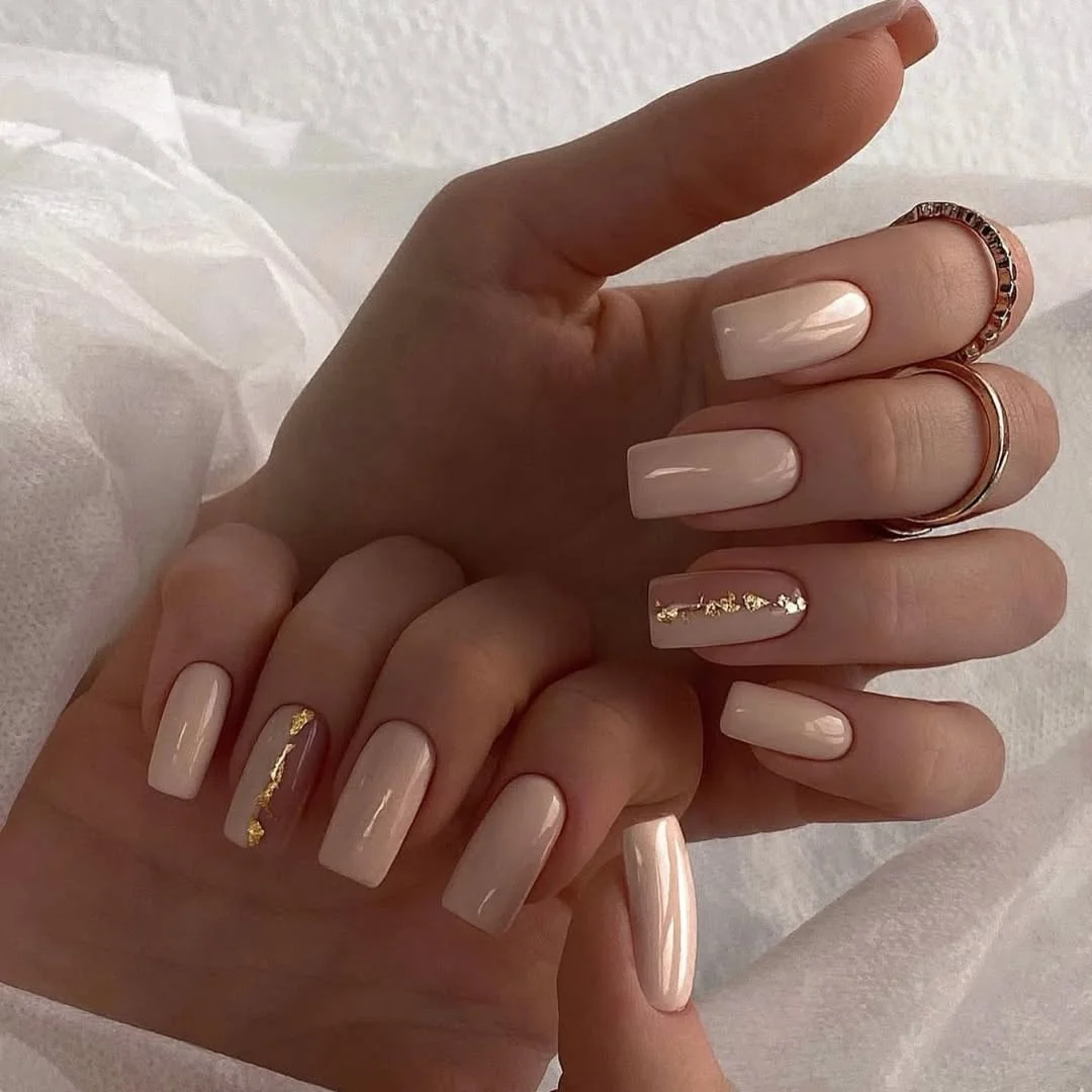 24 summer nail colors 2026 Milky Nude Nails With Gold Foil That Feel Quietly Luxurious