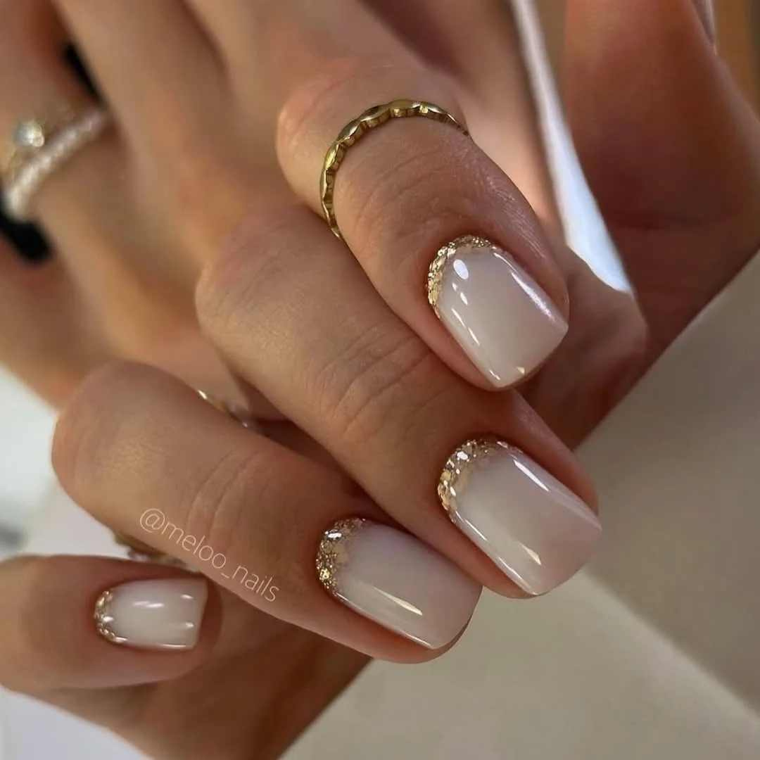 24 summer nail colors 2026 Milky White Nails With Gold Cuticle Sparkle That Feel Quiet Luxury Approved