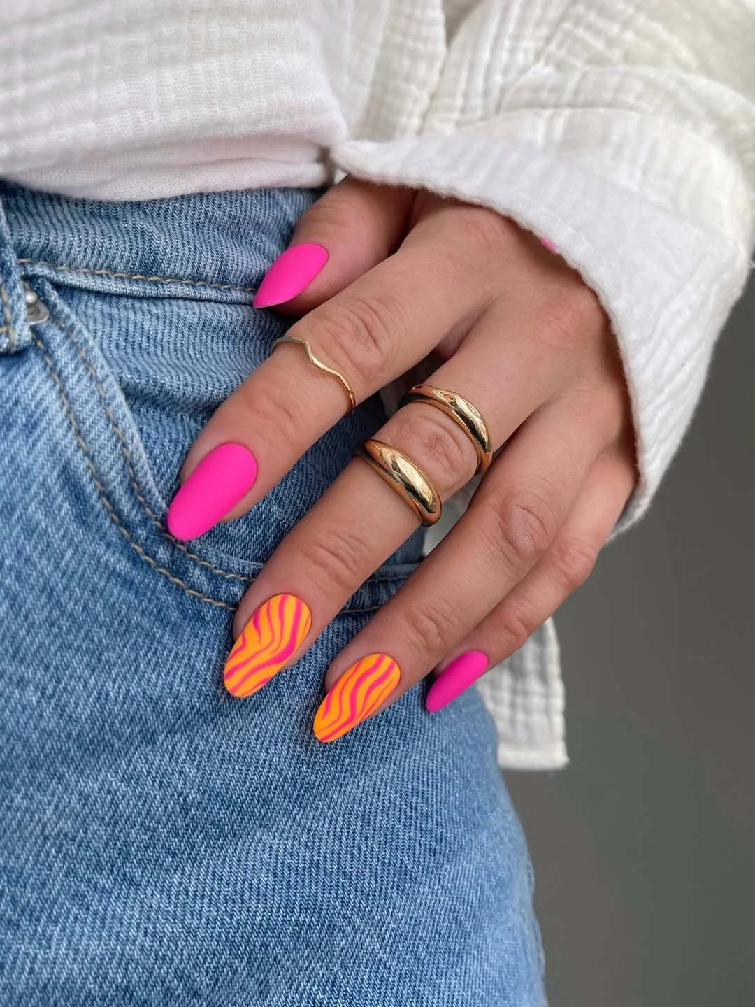 24 summer nail colors 2026 Hot Pink and Tangerine Swirl Nails That Refuse to Be Ignored