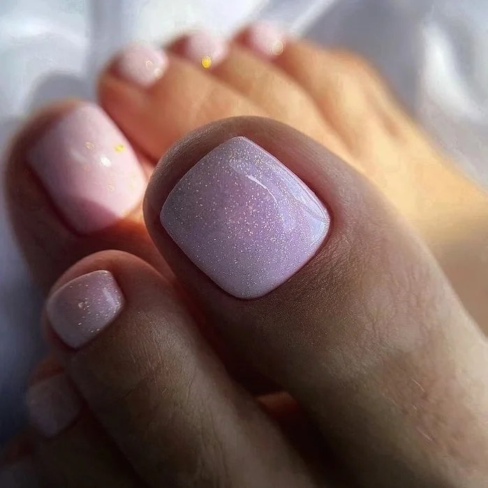 summer pedicure colors 2026 Soft Pink Shimmer Nails With a Barely There Glow