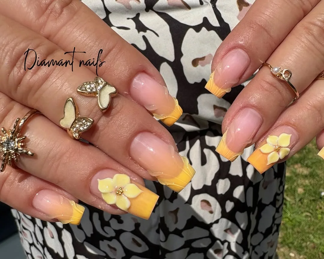 23 Summer yellow nails 2026 Soft Lemon French Tips With Floral Acrylic Details