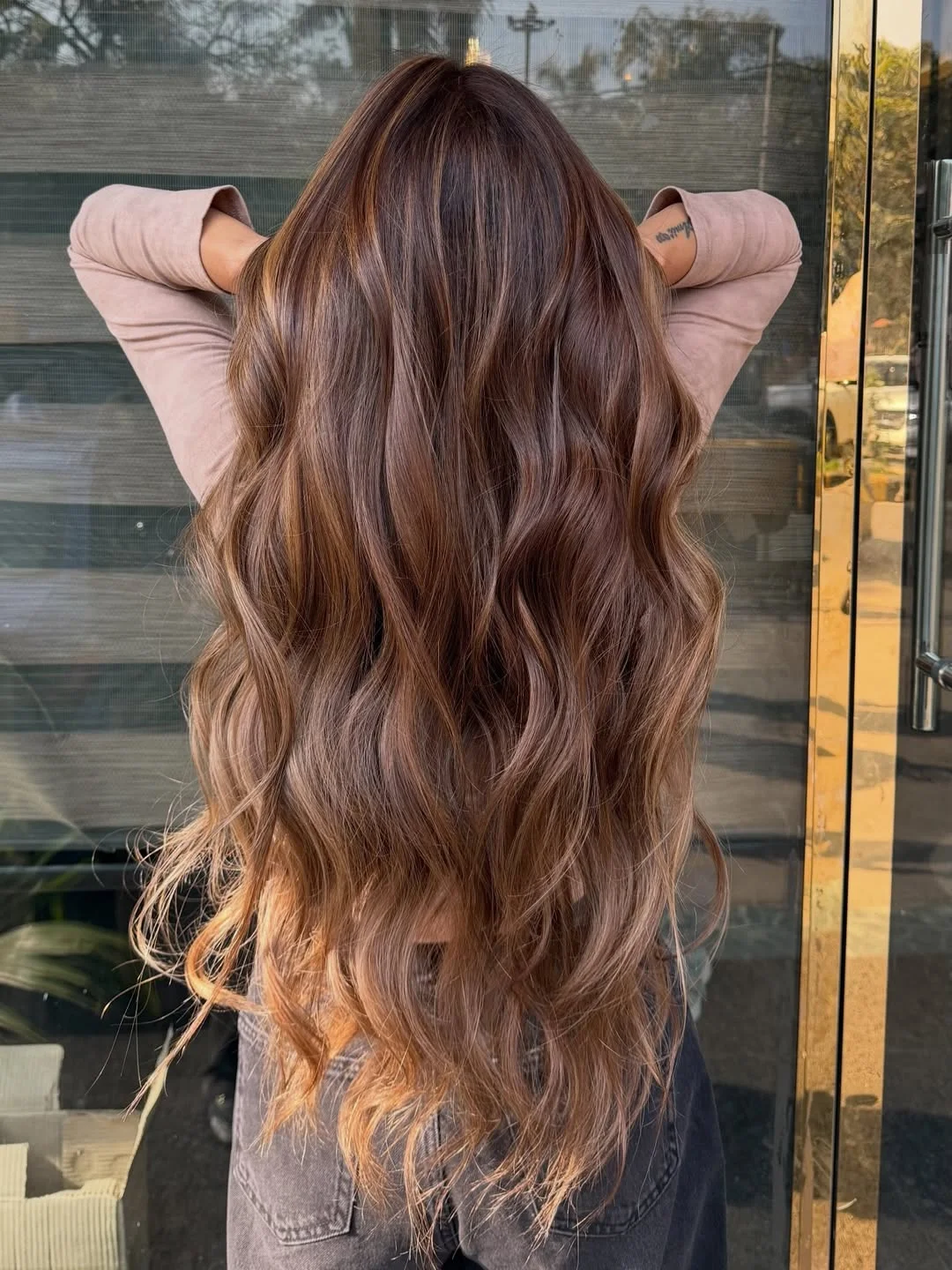 warm summer honey brown hair color 2026 Long Cinnamon Honey Waves With Melted Caramel Ends