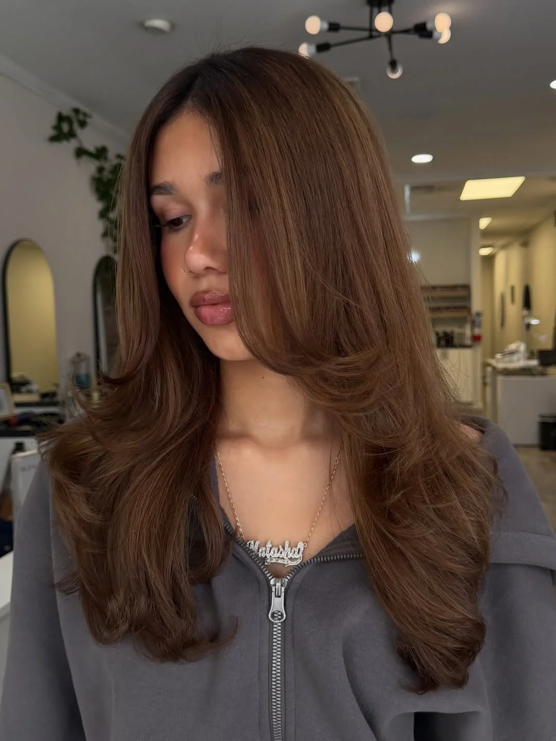 warm summer honey brown hair color 2026 Warm Cinnamon Honey Blowout With Soft Curved Layers