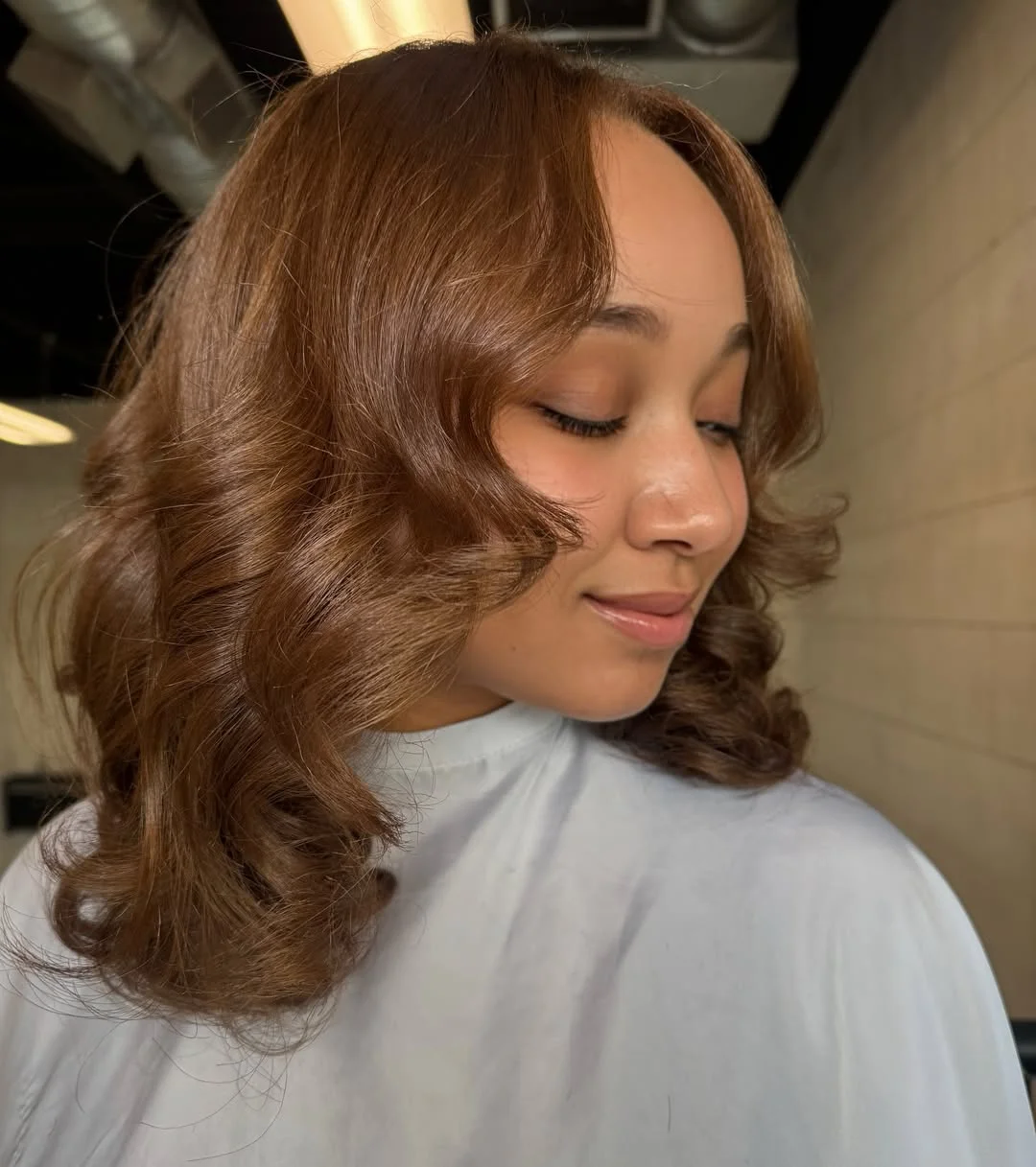 warm summer honey brown hair color 2026 Soft Curled Honey Brown Bob With Vintage Volume