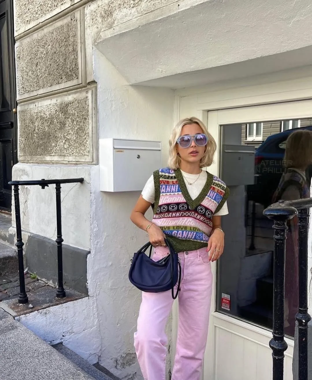 18 back to school outfits 2026 Pink Jeans and Patterned Knit Vest for Playful Campus Style