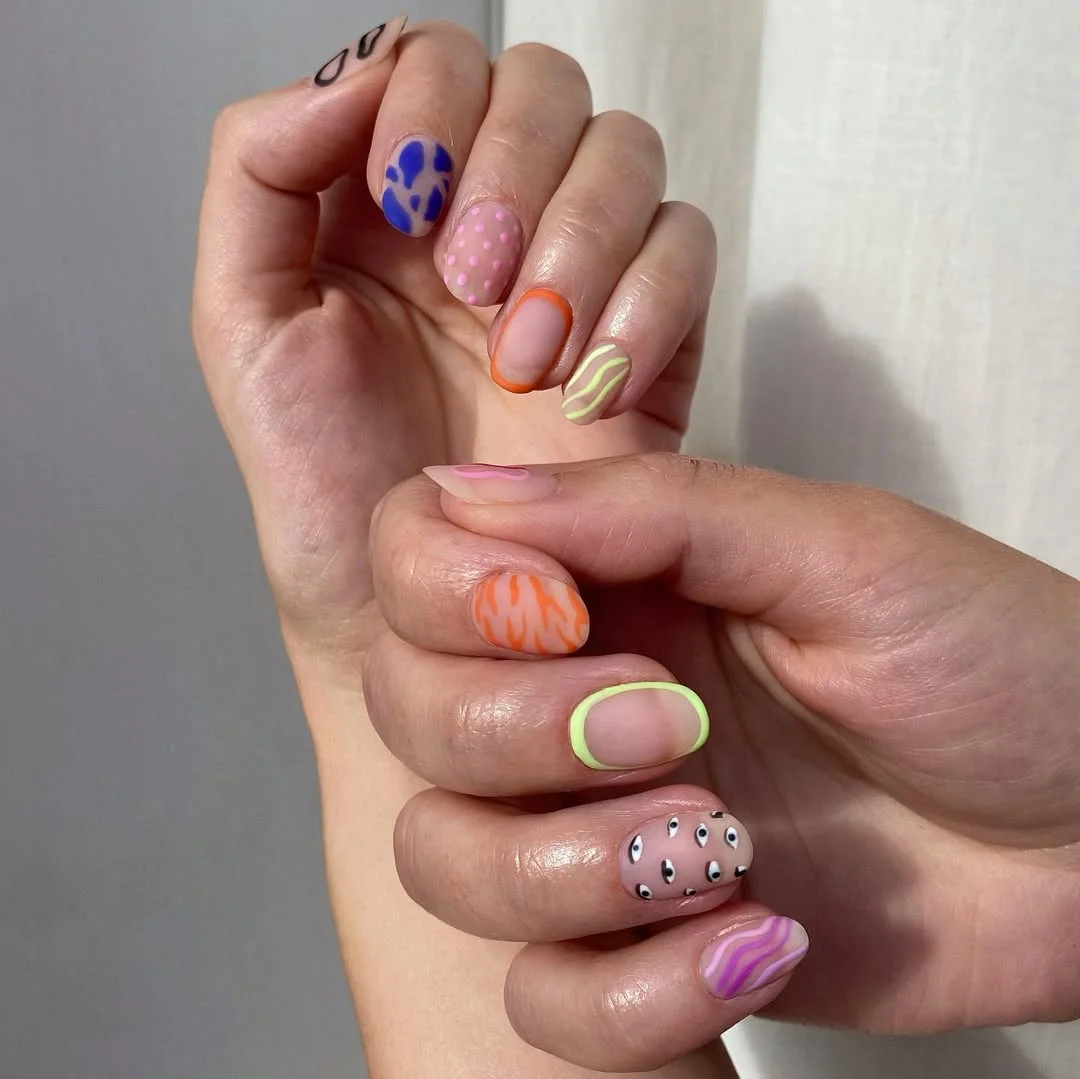 23 bright summer nails 2026 Playful Mixed Prints for a Modern Short Summer Manicure