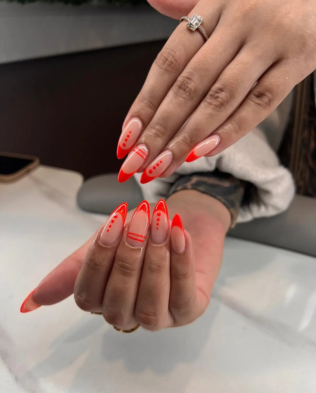 23 bright summer nails 2026 Neon Coral French Tips With Graphic Minimalist Details