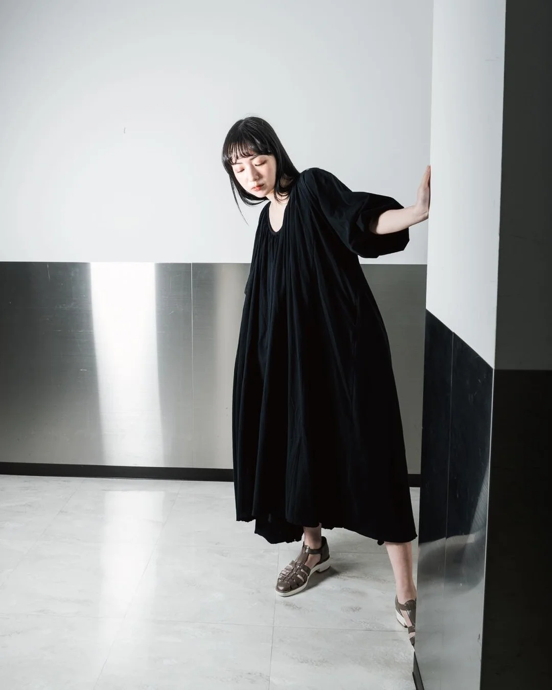 20 Early summer outfits 2026 Minimalist Black Dress with Modern Japanese Influence