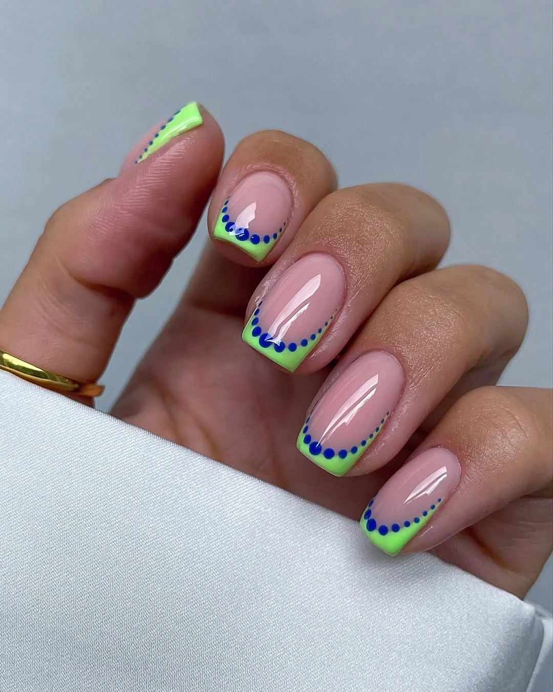 23 July nails design ideas 2026 Neon Lime French Tips With Blue Dot Accents