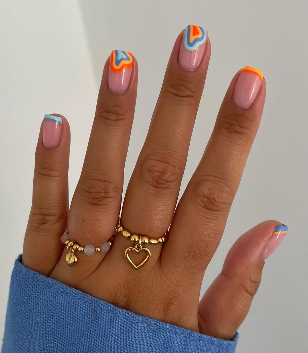 23 July nails design ideas 2026 Retro Blue And Orange Wave French Tips