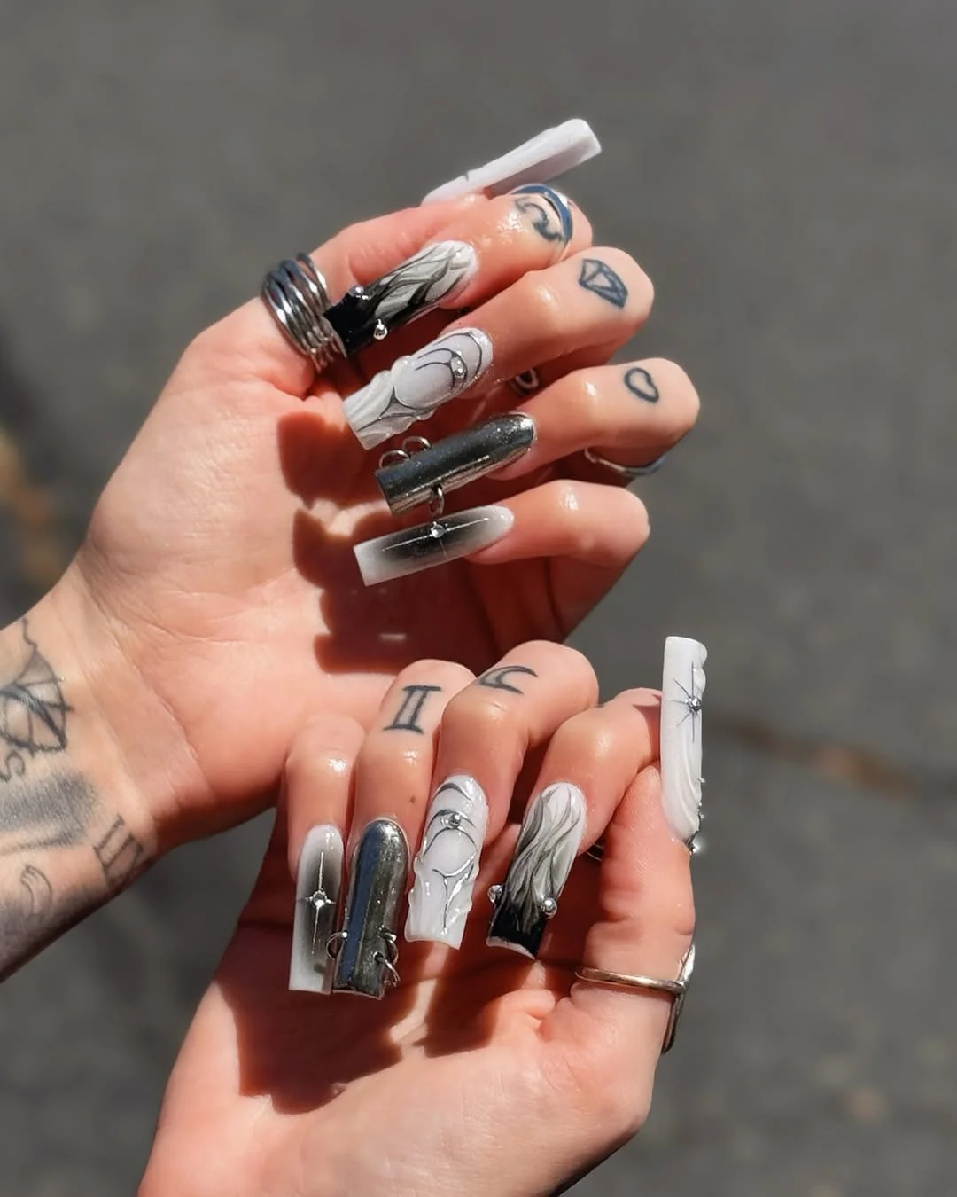 23 July nails design ideas 2026 Monochrome Gothic Chrome Nails With Sculptural Details