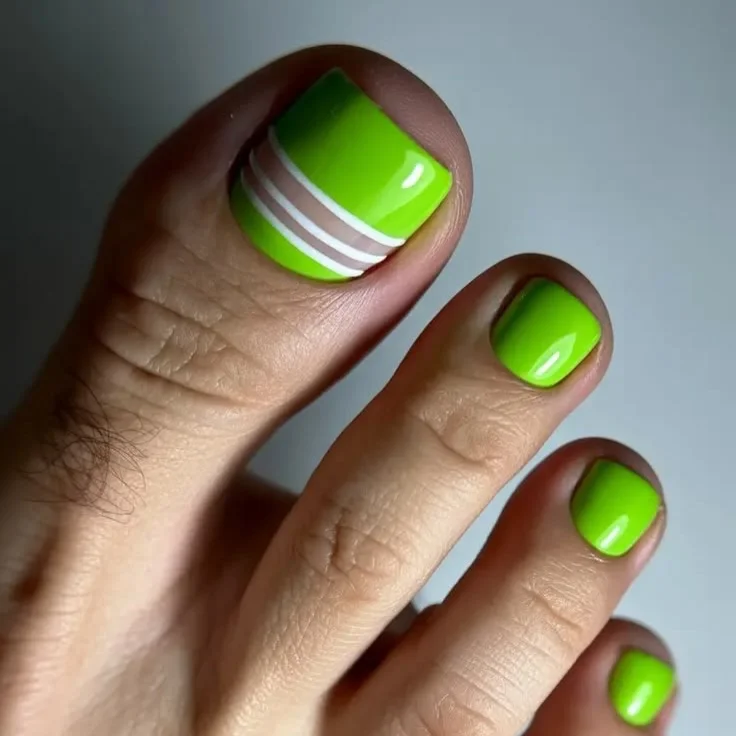 21 July toe nail colours ideas 2026 Neon Green Pedicure With Sporty Modern Lines