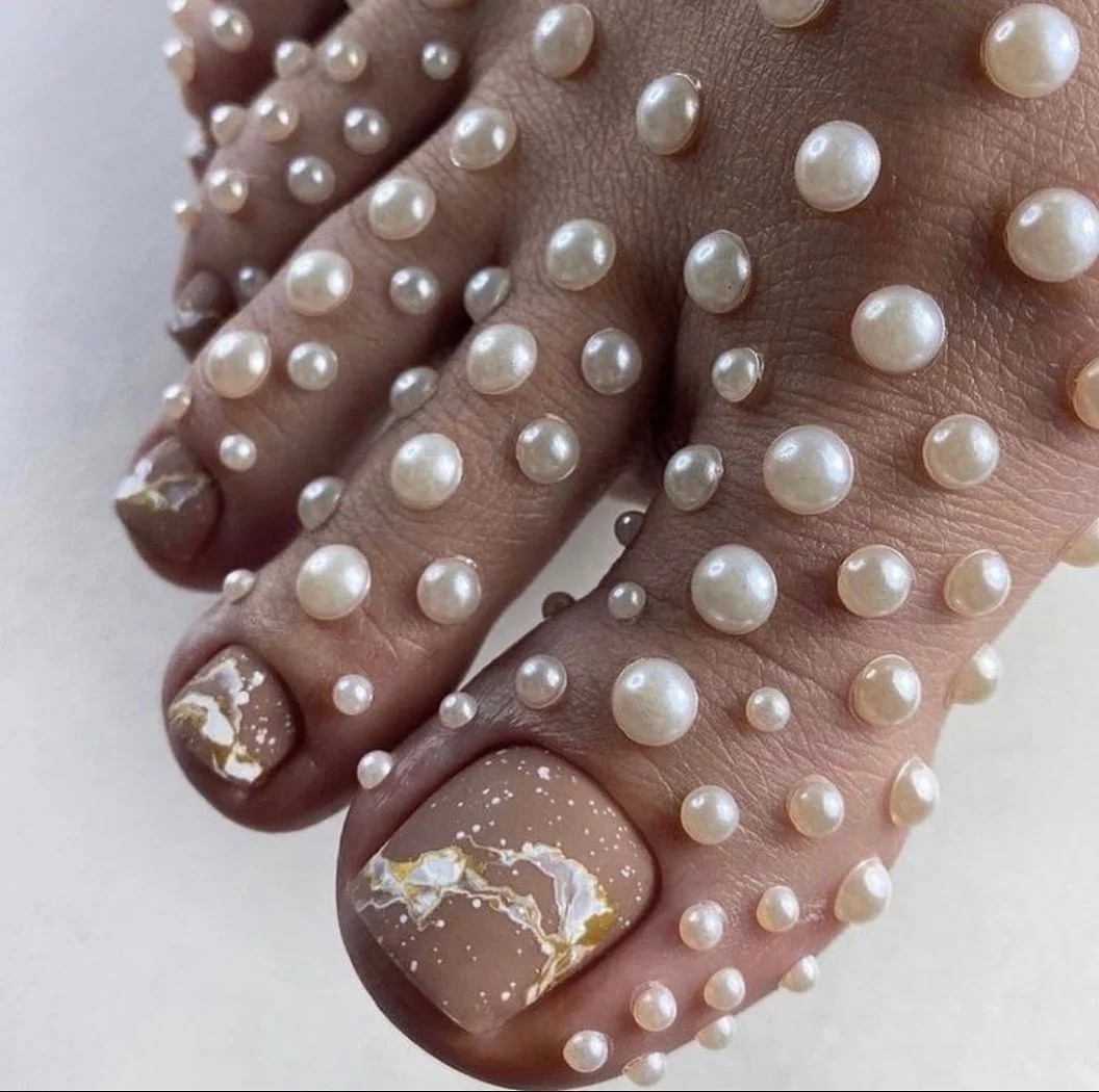 21 July toe nails design - summer ideas 2026 Pearl-Inspired Marble Pedicure With Quiet Luxury Charm