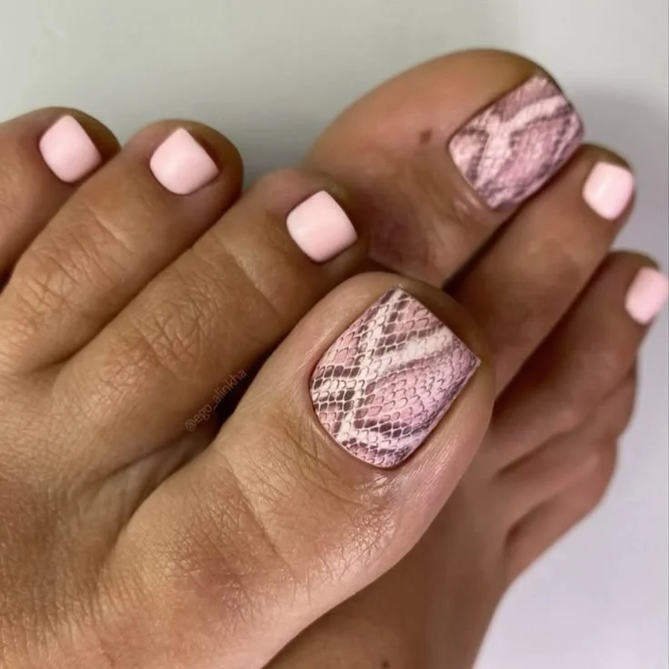 19 June pedicure ideas 2026 Soft Pink Snakeskin Accent Pedicure with Modern Edge