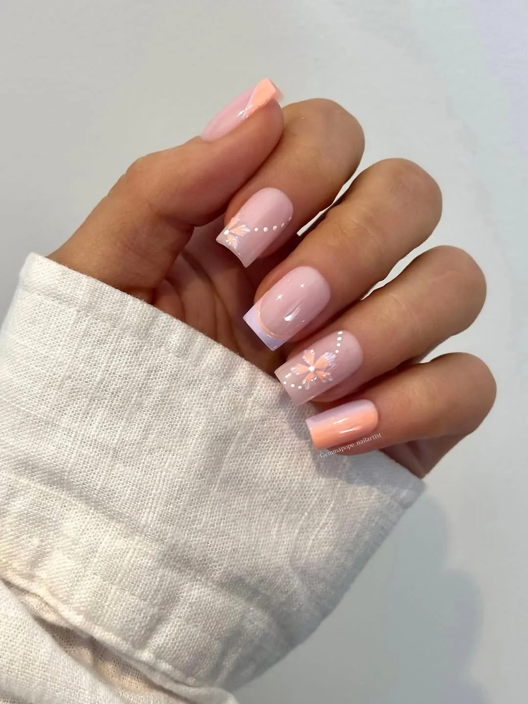 21 light summer nails 2026 Glossy Baby Pink Nails With Delicate Daisy Accents