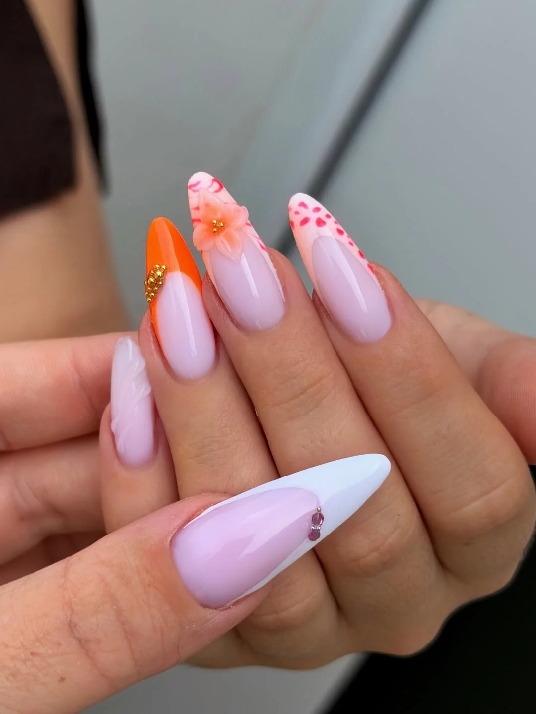 21 light summer nails 2026 Sunset Bloom Almond Nails With Coral Floral Accents