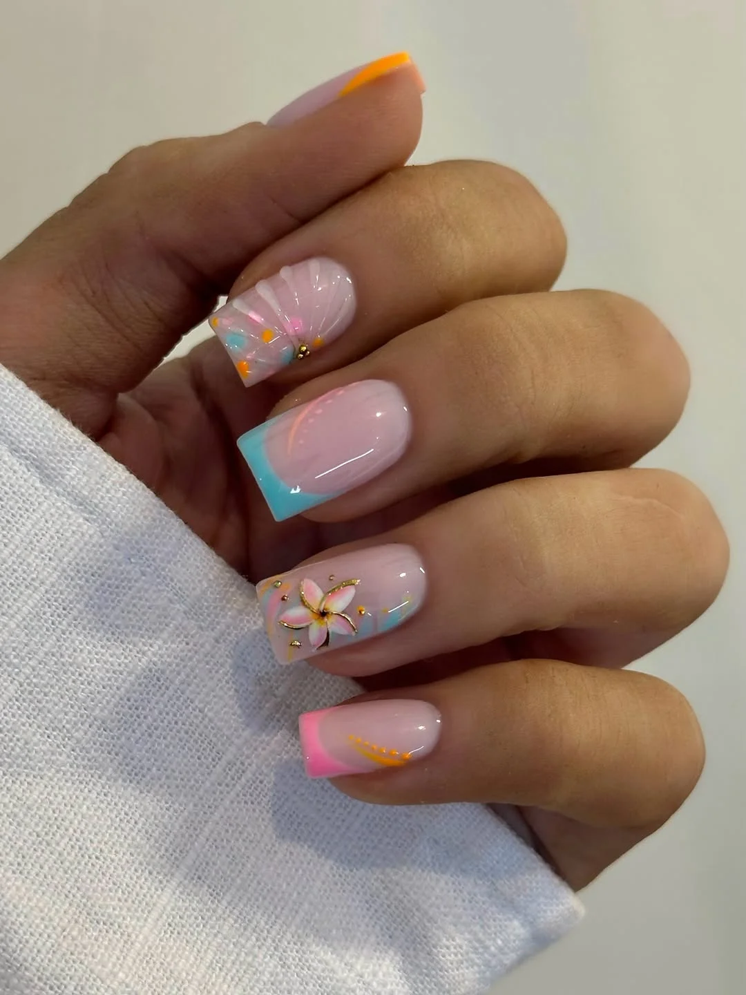 21 light summer nails 2026 Pastel Seashell French Nails With Tropical Flower Details