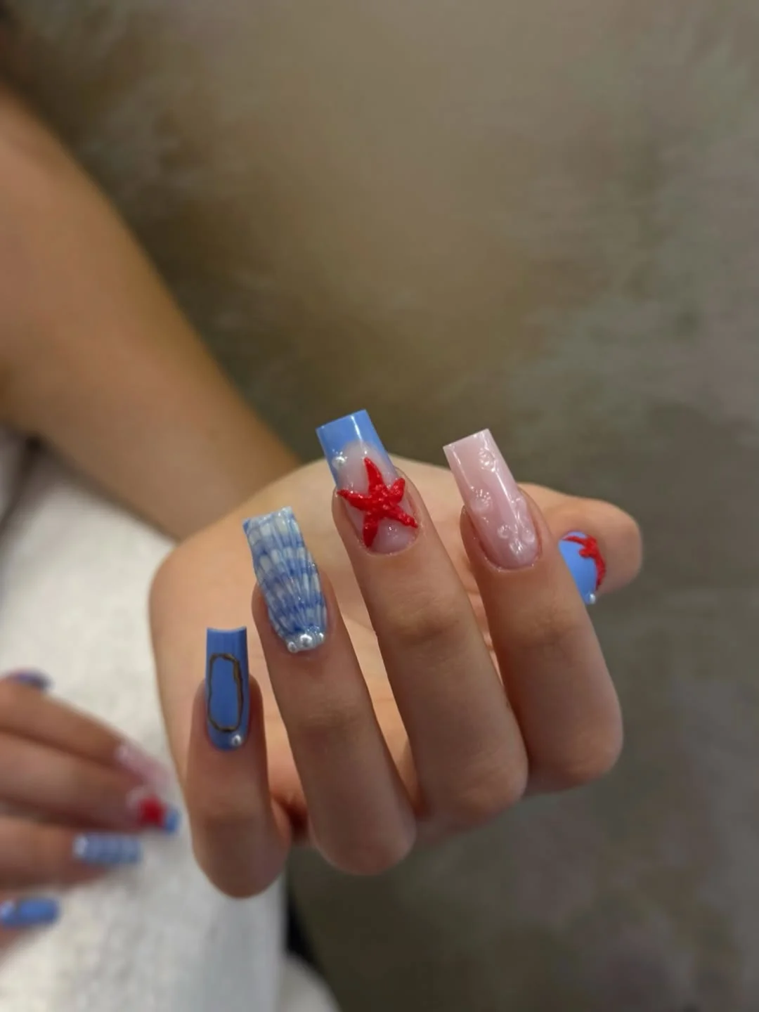 24 starfish summer nails 2026 Bold Blue and Red Starfish Art on Long Square Nails