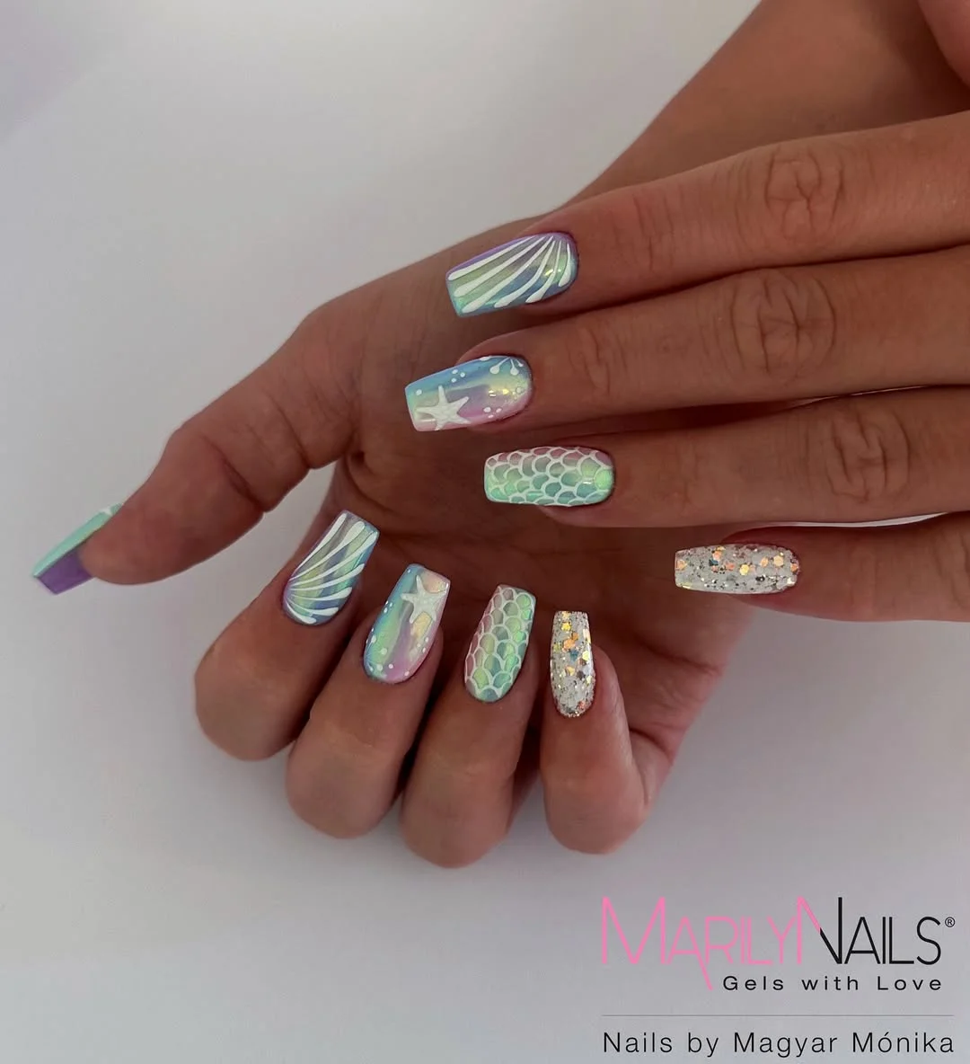 24 starfish summer nails 2026 Iridescent Mermaid Nails With Starfish and Silver Sparkle