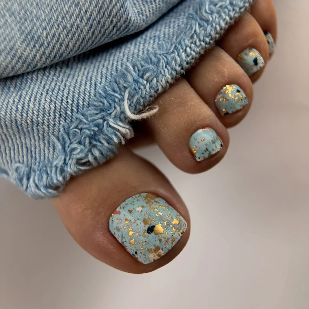 summer pedicure nail art 2026 Sky Blue Speckled Pedicure With Gold Foil Elegance