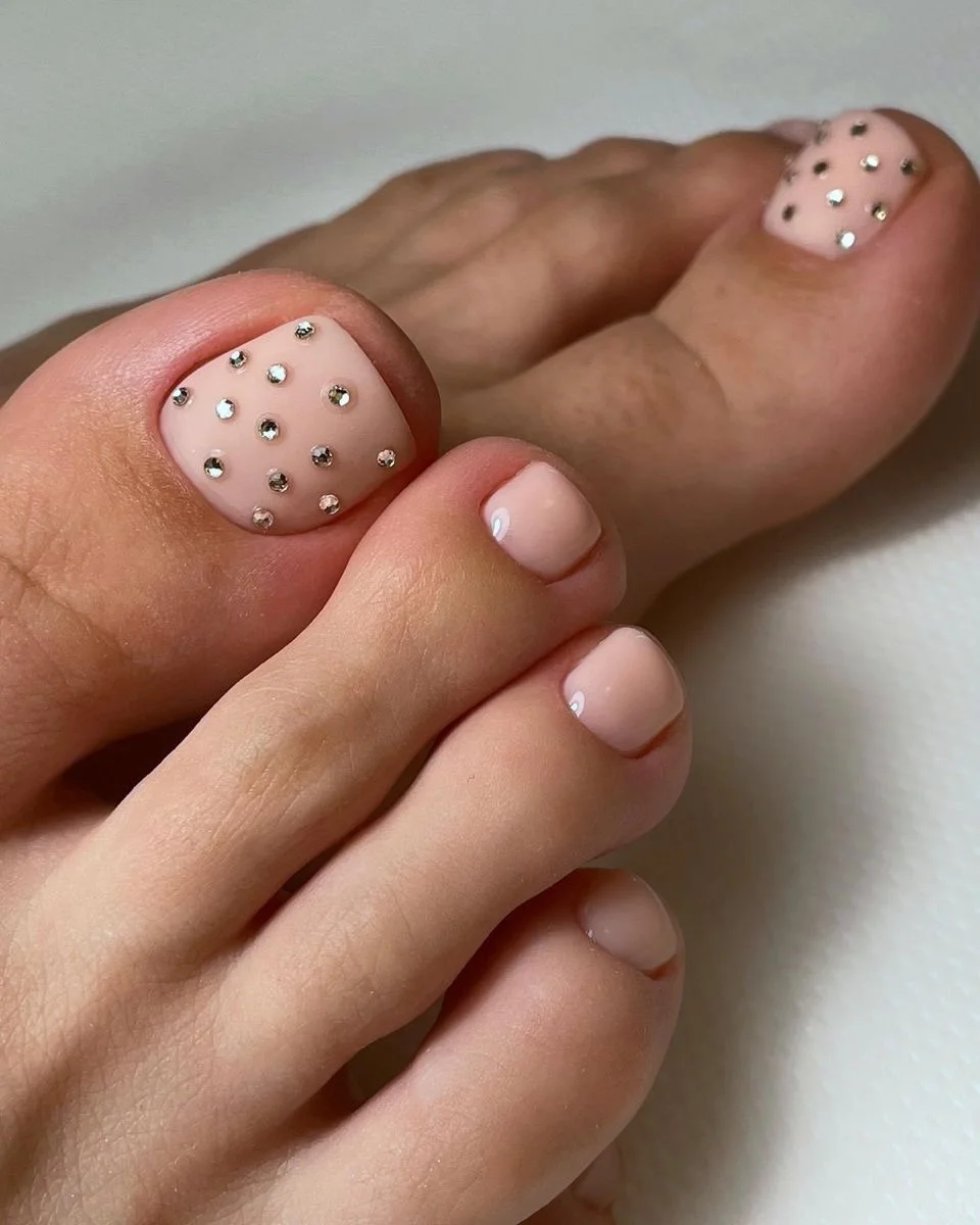 21 summer toe nails design ideas 2026 Soft Nude Pedicure With Delicate Crystal Embellishments